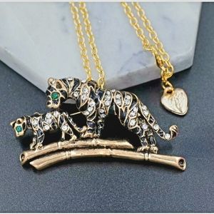 Gold plated white and green crystal tiger Mom and baby necklace/brooch